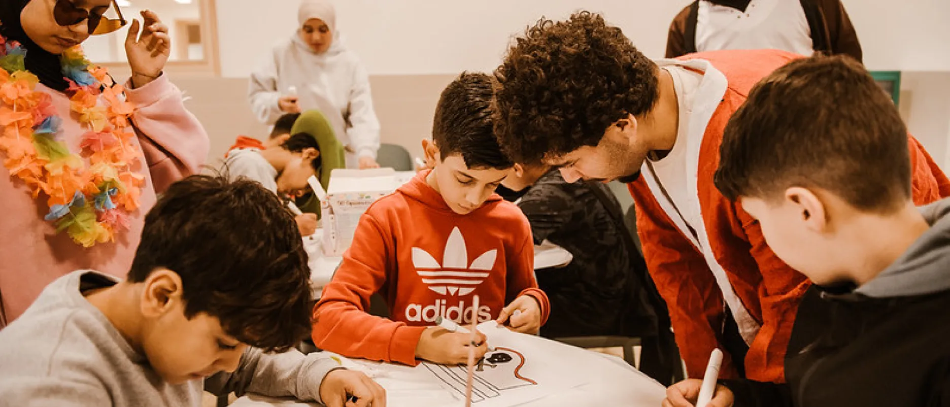 costumed volunteers with drawing children
